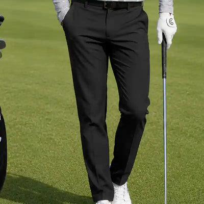 man wearing black golf pants, best golf pants for men