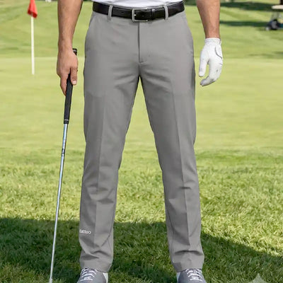 golfer wearing cool gray golf pants on a golf course