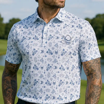 tattooed man wearing a white polo shirt with blue skull pattern outdoors