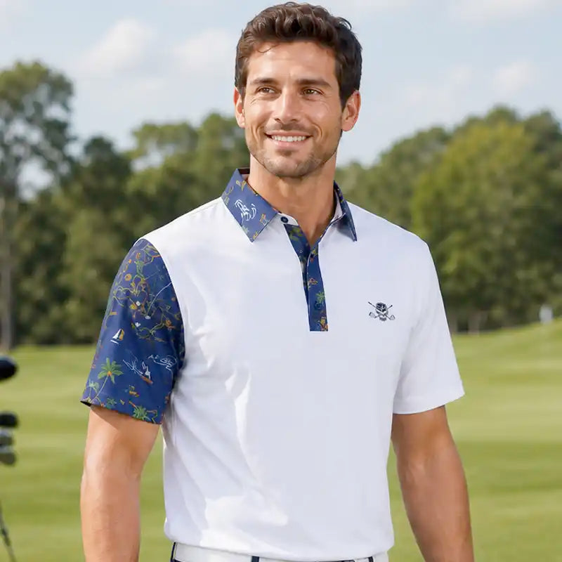 Man wearing a white polo shirt with blue patterned sleeves on a golf course