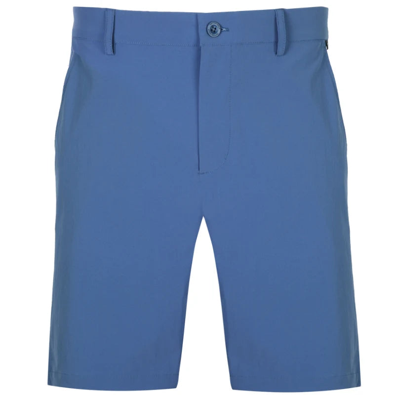 A pair of men's golf shorts in blue color with a button closure and a subtle skull design on the waistband.