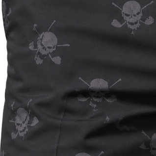 Detail of grey skull-and-crossed-clubs motifs printed across black shorts fabric.