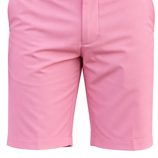 Close-up of pink golf shorts showing the front fly and hems.