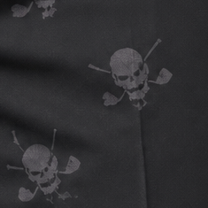 Close-up of two grey skull-and-crossed-clubs motifs on folded black fabric.