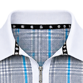 Detail of the white collar, zip fastening and patterned inner neck trim on a grey and blue plaid polo.