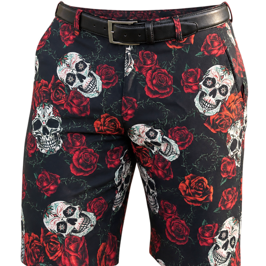 Tighter front view of sugar-skull and red-rose golf shorts with a black belt.