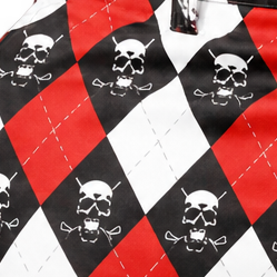 Detail of white skull-and-crossed-clubs motifs on red, white and black argyle fabric.