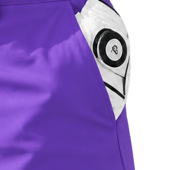 Close-up of a white golf glove tucked into the pocket of purple shorts.