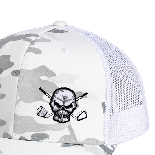 Detail of the skull logo and white mesh panel on a white camouflage cap.