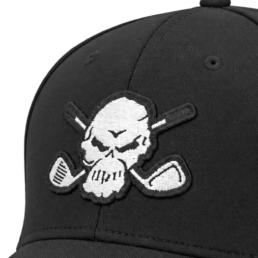 Close-up of a white skull-and-crossed-clubs patch on a black cap.