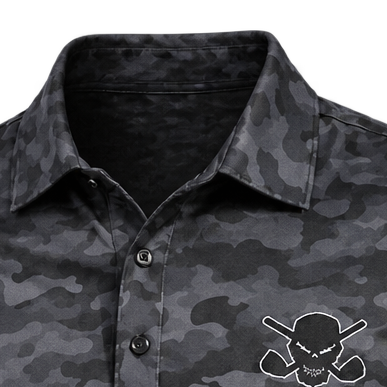Close-up of the collar, button placket and chest-logo edge on a dark grey camouflage polo.