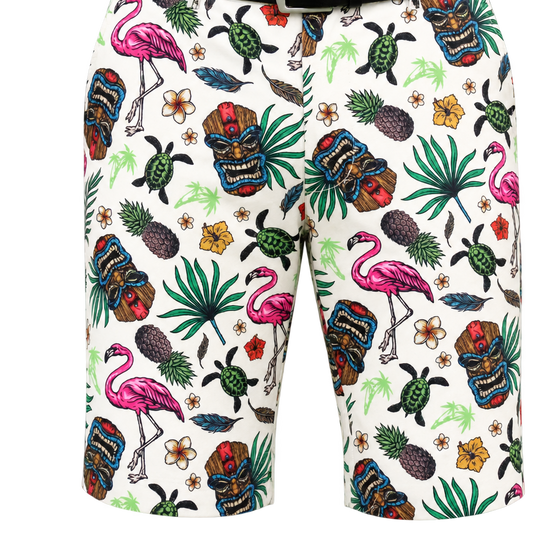 Close-up of the front of white Tiki golf shorts, showing belt loops and colorful tropical graphics.