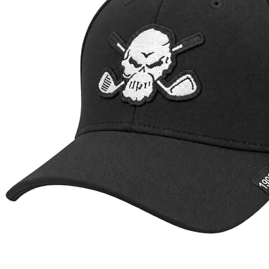 Detail of a black cap's skull patch, front seam and curved brim.