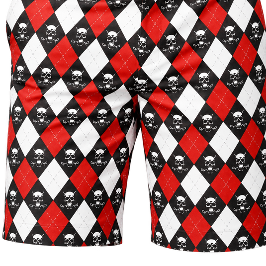 Close-up front view of red, white and black argyle golf shorts with repeating skull motifs.