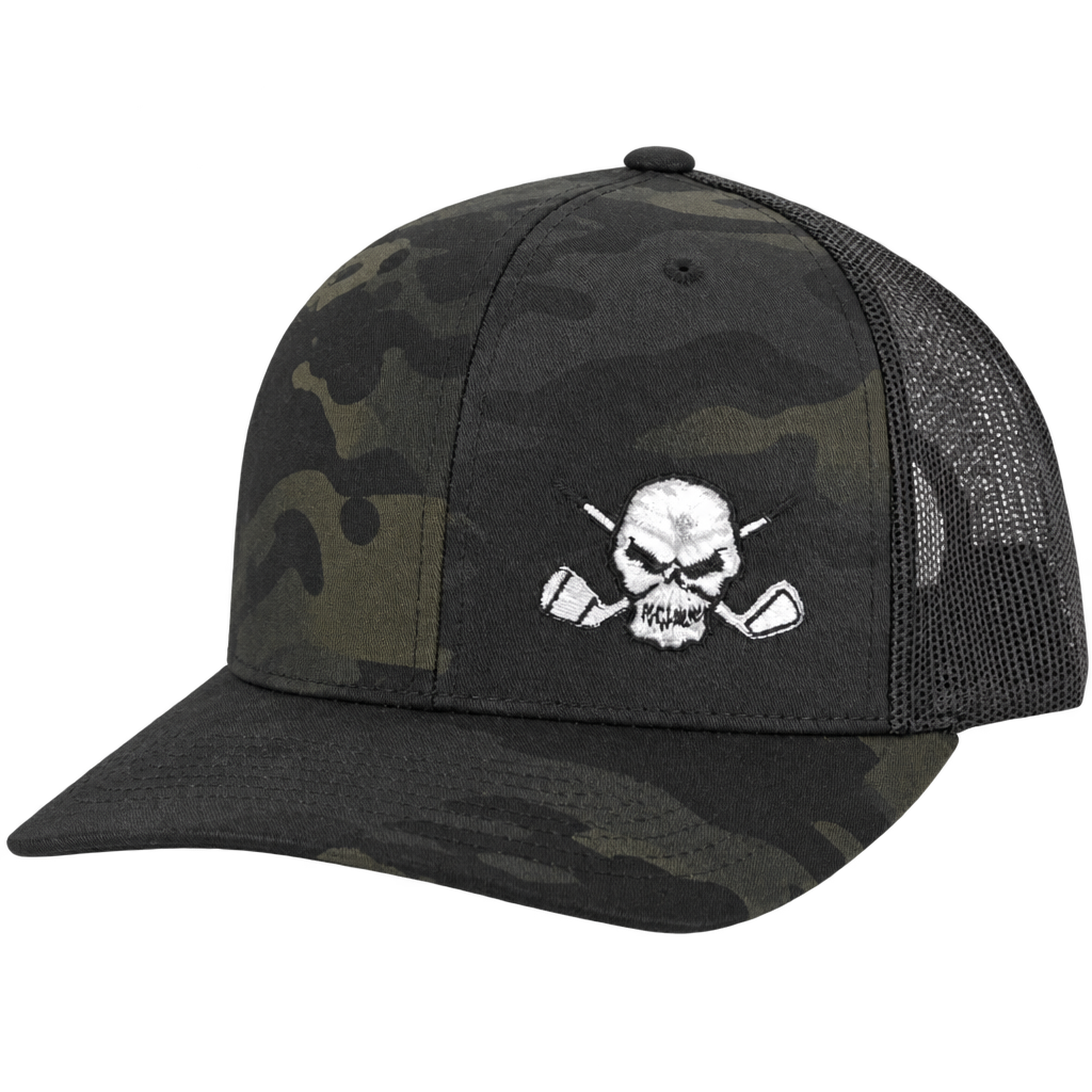 Dark camouflage trucker cap with black mesh sides and a white skull logo.