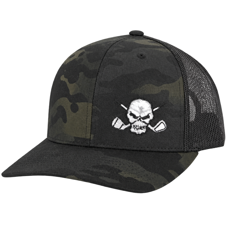Dark camouflage trucker cap with black mesh sides and a white skull logo.