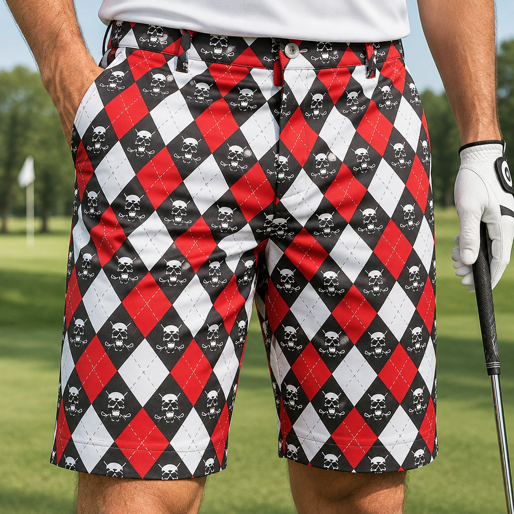 Close-up of red, white and black argyle shorts worn with a white polo and white golf glove.