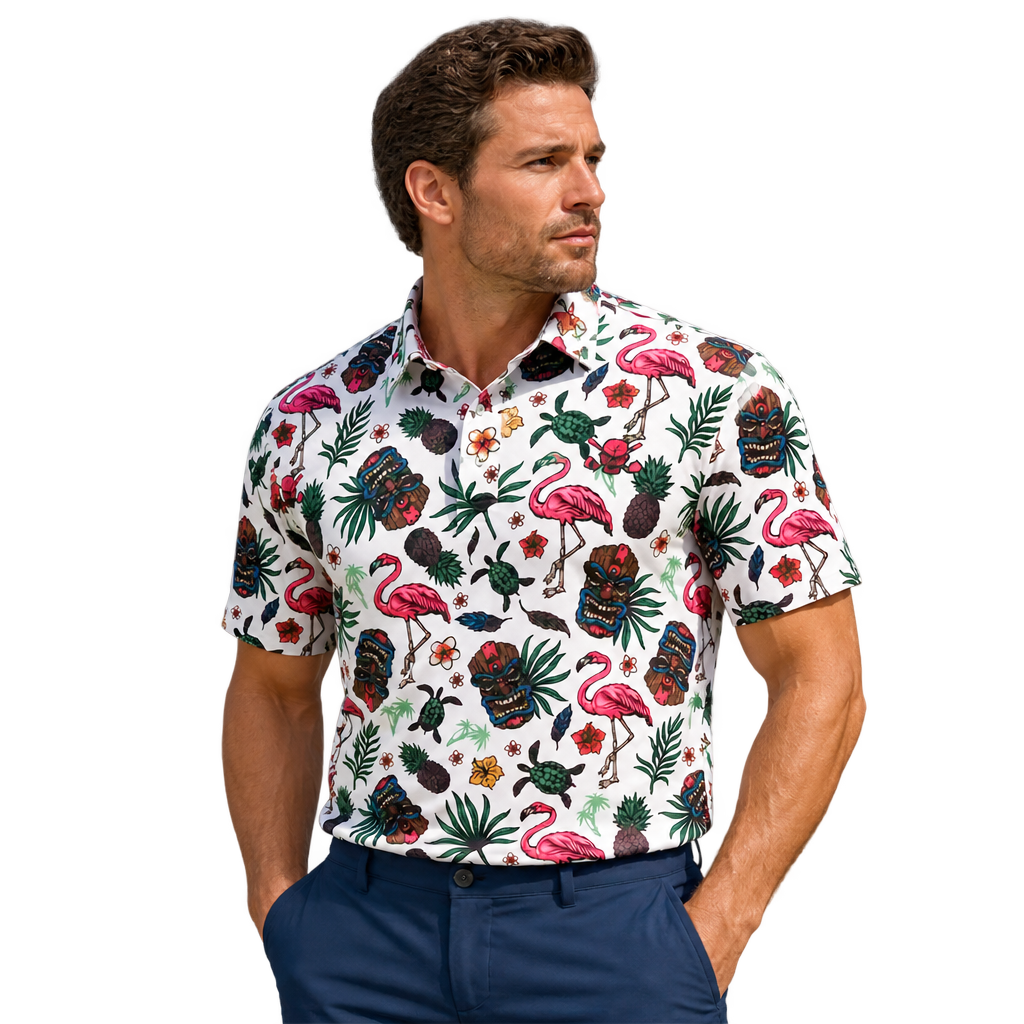 Man wearing a white polo printed with pink flamingos, tiki masks and tropical foliage.