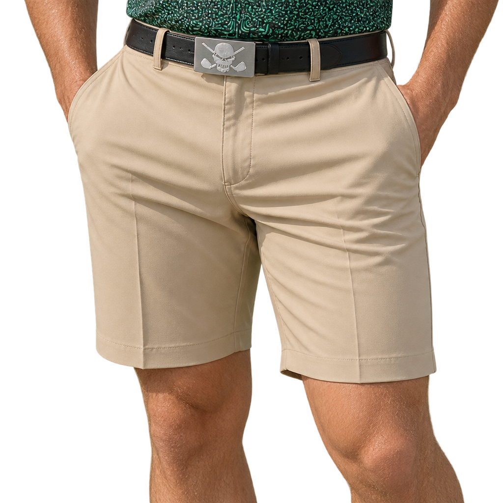 Man wearing khaki golf shorts with a black skull-buckle belt and a patterned green polo.