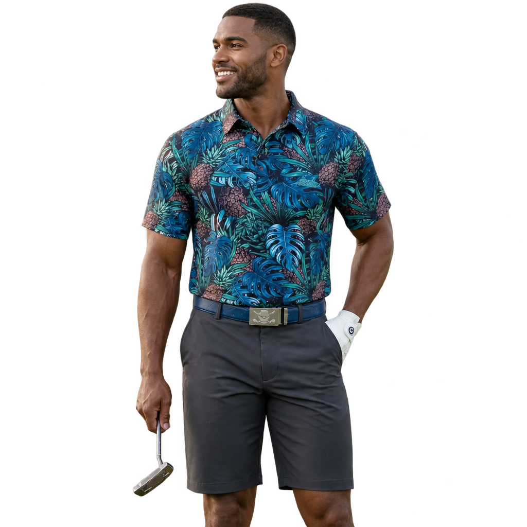 Golfer wearing a blue tropical-leaf polo, charcoal shorts and navy belt.