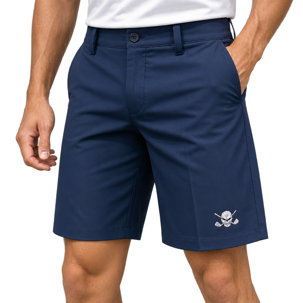 Man wearing navy golf shorts with a white skull-and-crossed-clubs logo near the hem, paired with a white polo.