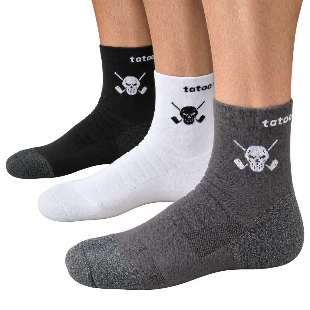 Black, white and grey quarter-length skull-logo socks shown on feet.