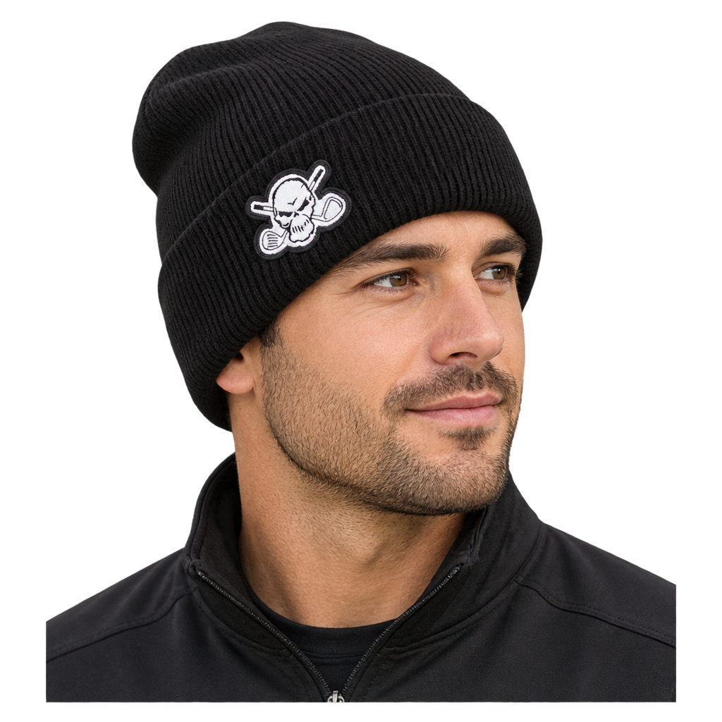 Man wearing a black rib-knit beanie with a white skull-and-crossed-clubs patch.