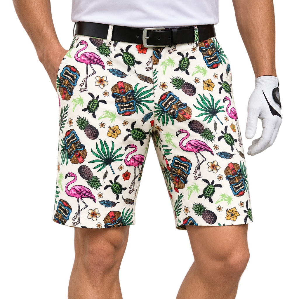 Man wearing white Tiki golf shorts with multicolor tropical print, a white polo, black belt and white golf glove.