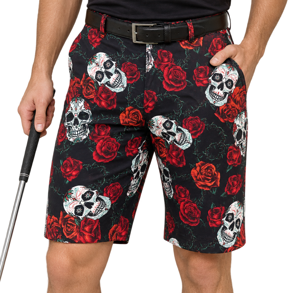Golfer wearing black shorts with white sugar skulls and red roses, paired with a black belt.