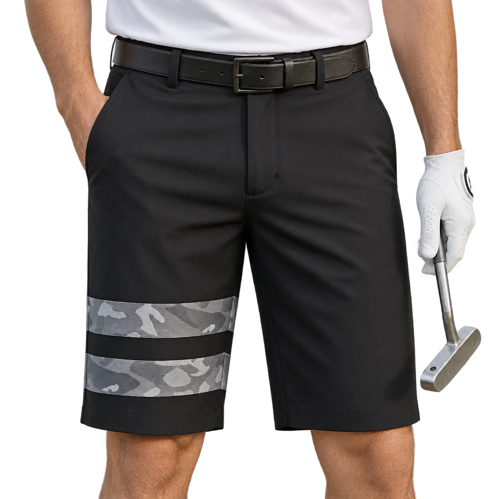 Golfer wearing black shorts with two grey camouflage bands on one leg, holding a putter.
