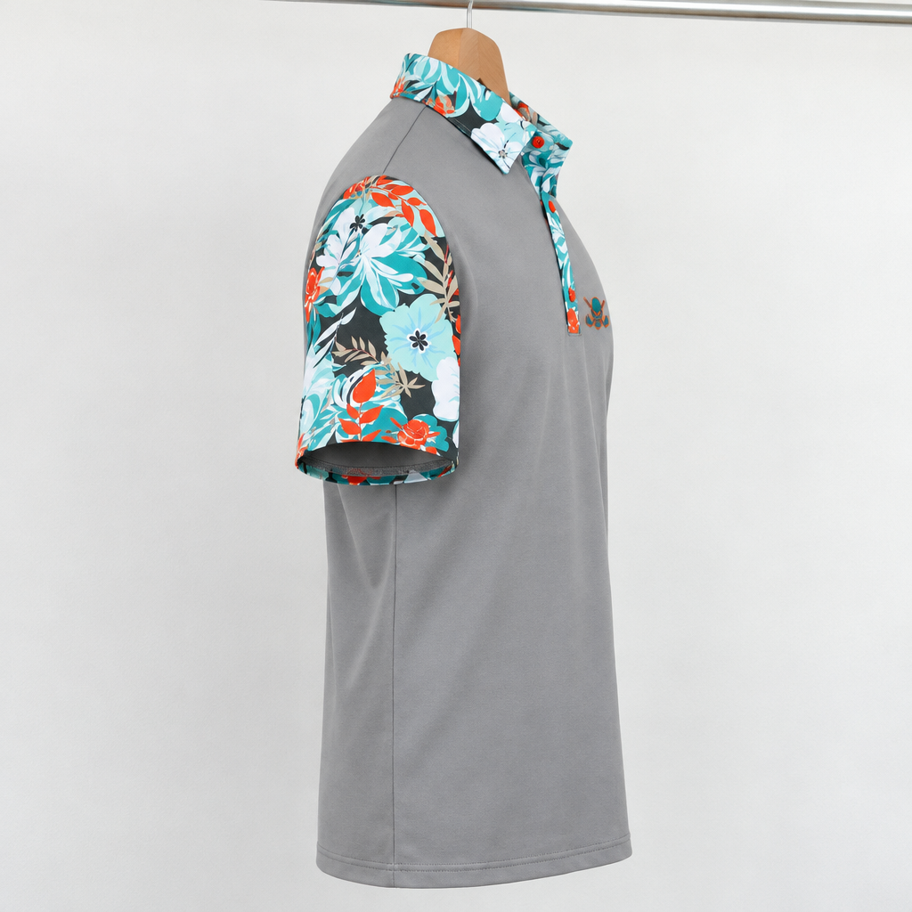 Grey VIP polo hanging from a wooden hanger, shown from the floral-sleeve side.