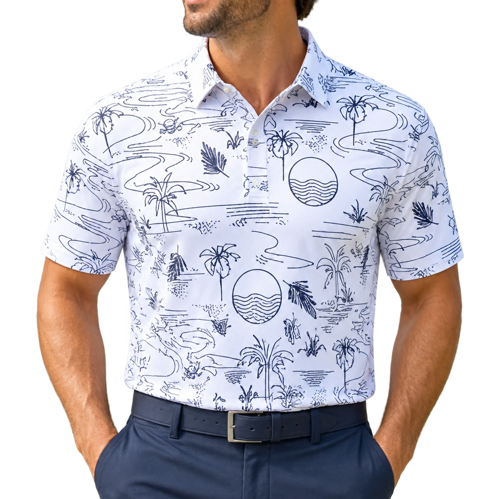 Man wearing a white golf polo with dark tropical line art, including palm trees and circular wave motifs, with navy trousers.