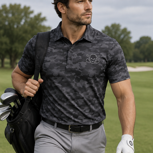 Golfer carrying a golf bag while wearing a dark grey camouflage polo and grey trousers.