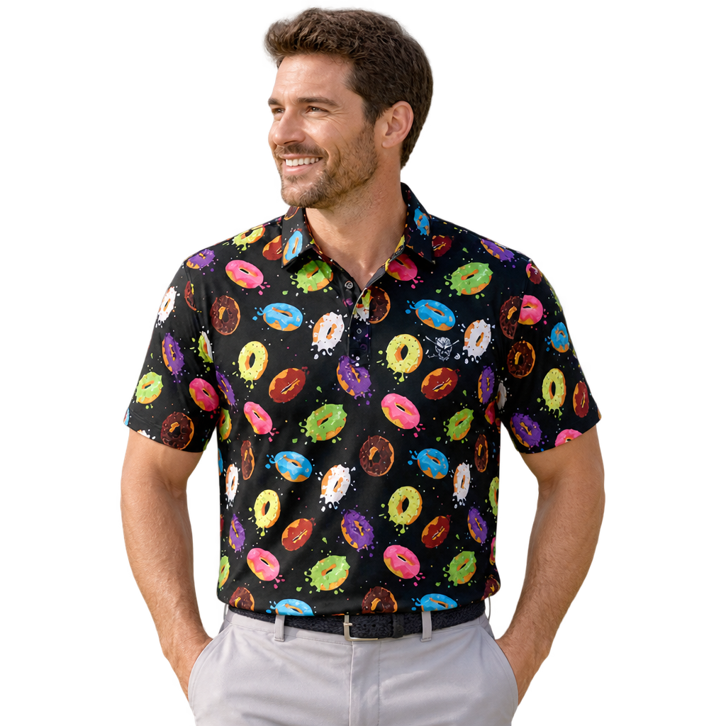 Man wearing a black golf polo covered in colorful doughnut graphics, paired with light grey trousers.