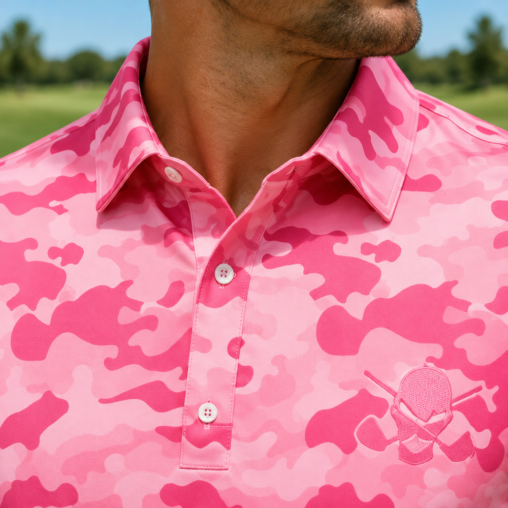Close-up of the collar, buttons and chest logo on a pink camouflage polo.