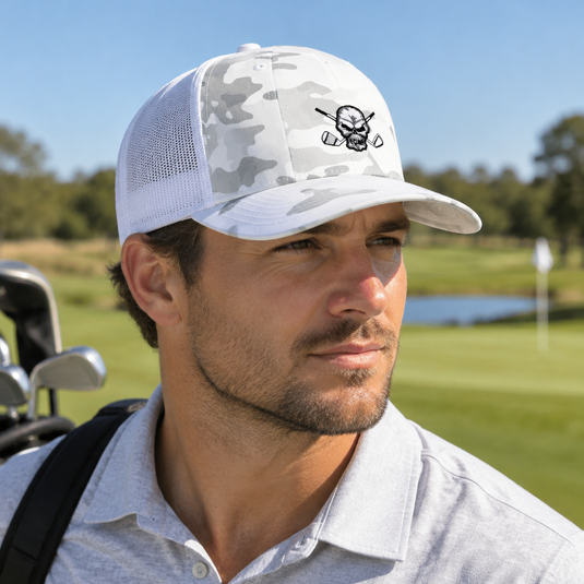 Golfer wearing a white camouflage skull-logo cap.
