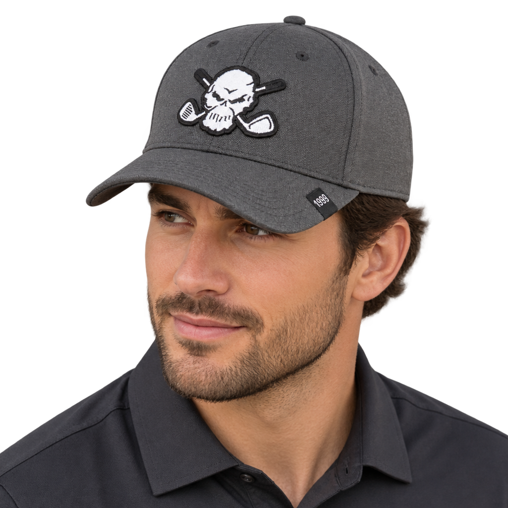 Man wearing a charcoal-grey skull-patch cap.