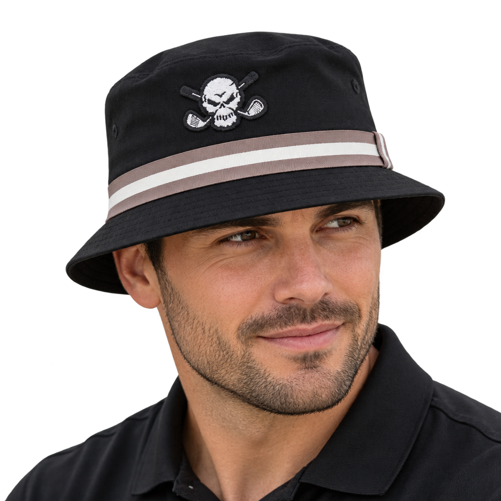 Man wearing a black bucket hat with a skull patch and taupe-and-white striped band.