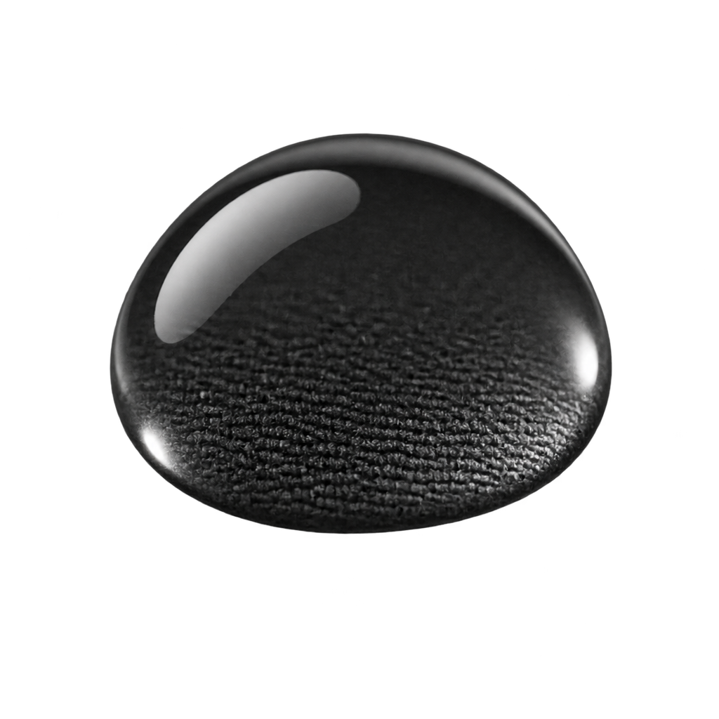 Illustration of a clear water droplet over black textured fabric.