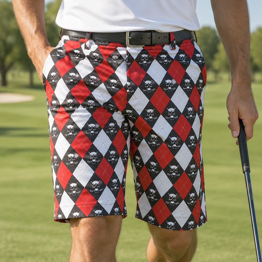Golfer wearing red, white and black argyle shorts with a black belt, holding a club.