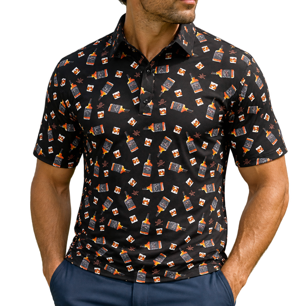 Man wearing a black golf polo with a repeating whiskey-glass print, paired with navy trousers.