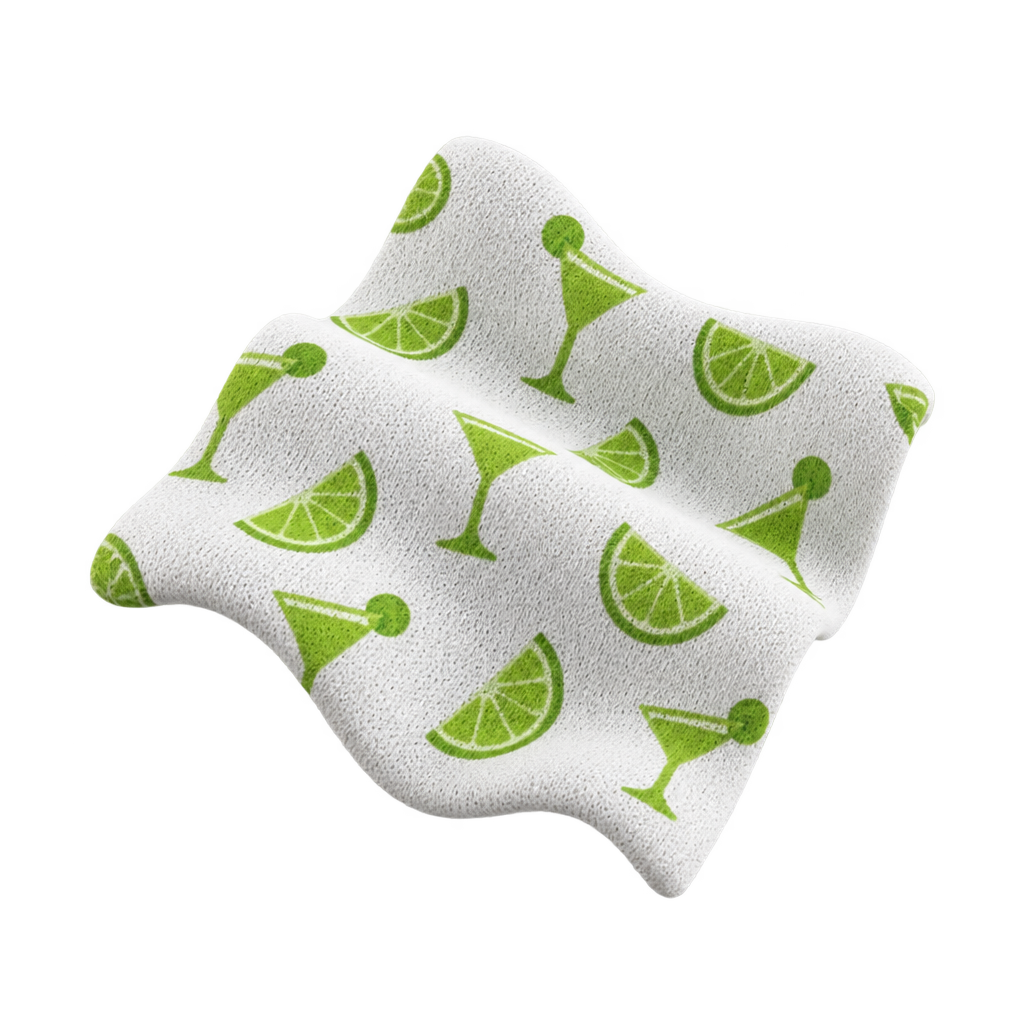 Illustration of white knitted fabric printed with green cocktail glasses and lime wedges.