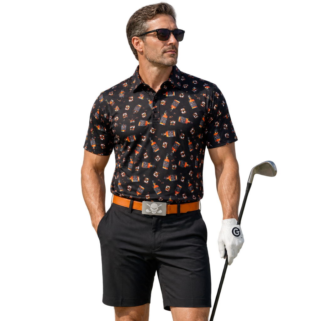 Man wearing a black whiskey-print golf polo, black shorts and an orange skull-buckle belt, holding a golf club.