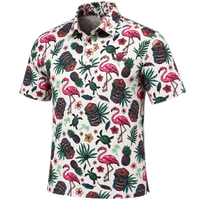 Angled view of a white tropical-print polo with pink flamingos and tiki masks.