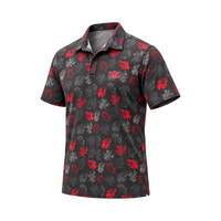 Angled view of a black red-and-grey floral polo displayed on white.