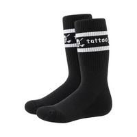 Pair of black crew socks with white stripes, skull motifs and Tattoo lettering.
