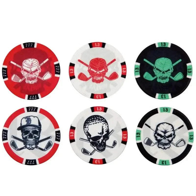 A collection of ceramic golf ball markers with various Tattoo Golf skull designs in red, black, green, and white colors.