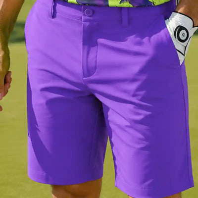 men's purple golf shorts worn by a person on a golf course