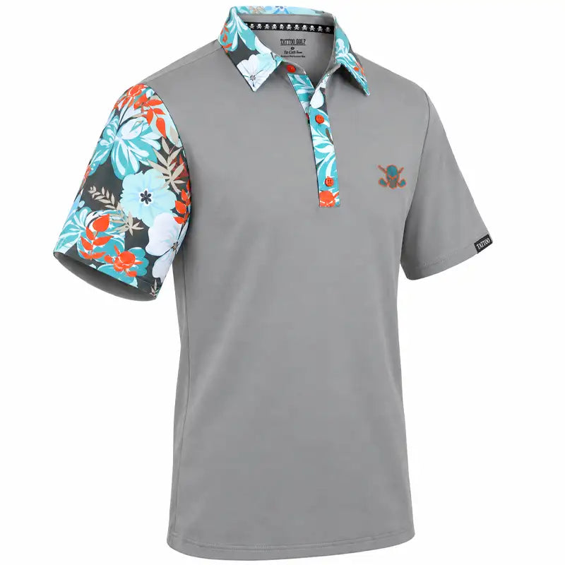 Angled front view of a grey VIP polo with teal, white and orange floral accents and a small chest logo.