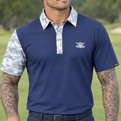 Golfer wearing a navy VIP polo with white and grey camouflage accents and a skull-and-crossed-clubs chest logo.